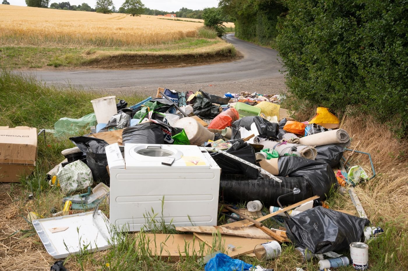 Cautious Optimism Over Latest Fly Tipping Figures   Fly Tipping On Country Lane EDITORIAL ONLY Shutterstock 1400x930px #keepProtocol